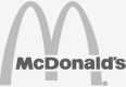Логотип корпорации Макдональдс обесцвеченный